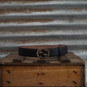 Black and Gold traditional monogram Gucci belt.
